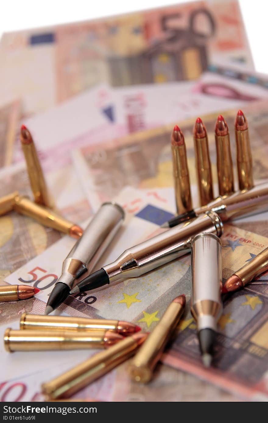 Bullets and money showing a dangerous side to life. Bullets and money showing a dangerous side to life