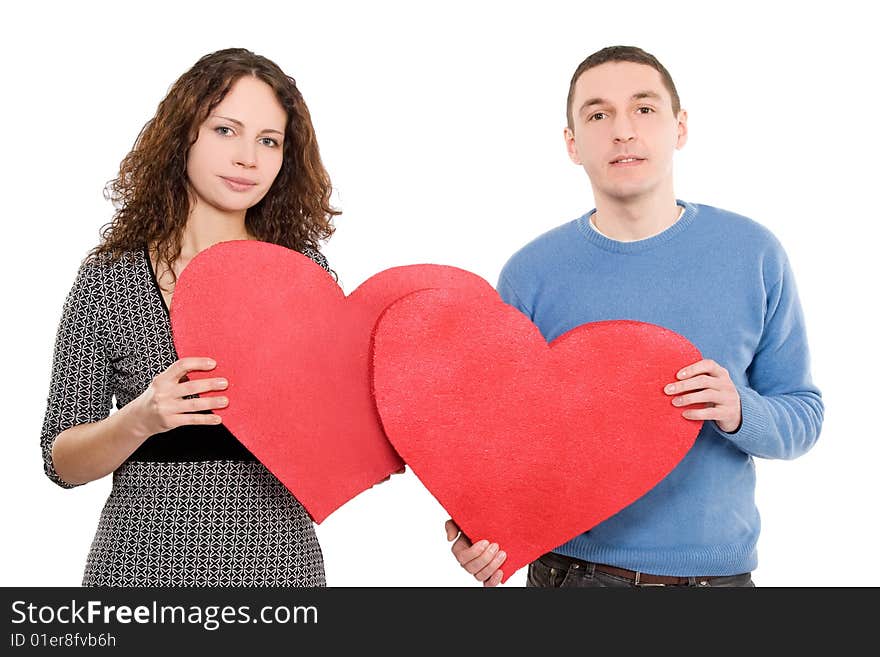 Loving couple holding hearts together isolated over white background