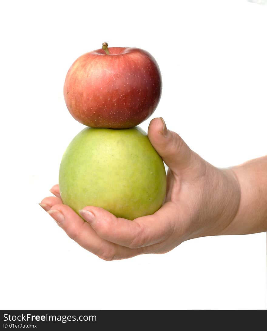 Hand with green and red apples isolated on white background