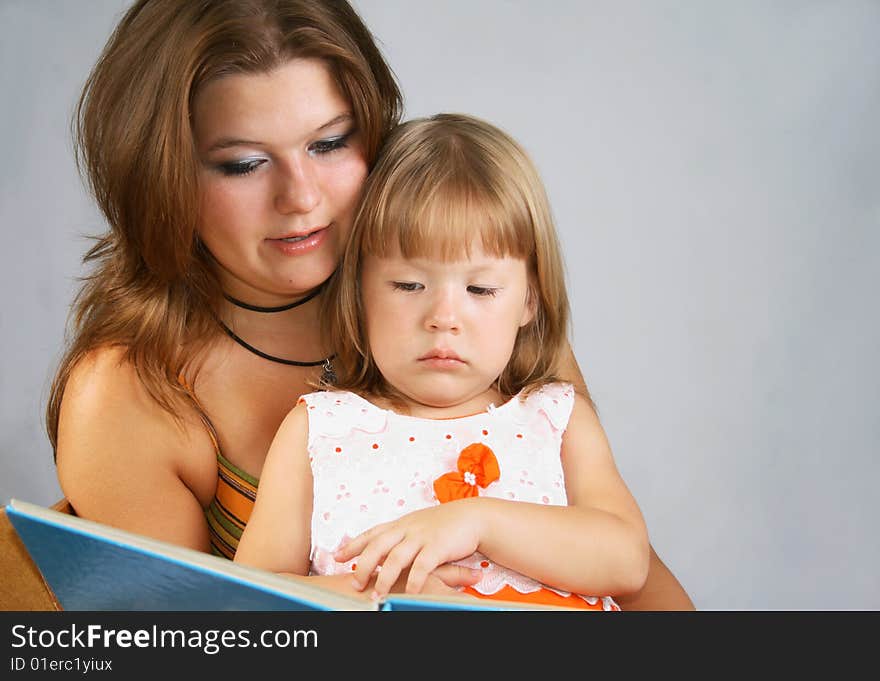 Two sisters read the book