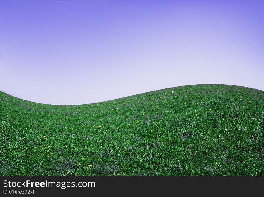 Wavy green landscape under blue sky. Wavy green landscape under blue sky