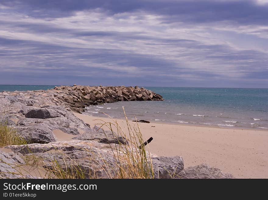 French beach under cloudy sky