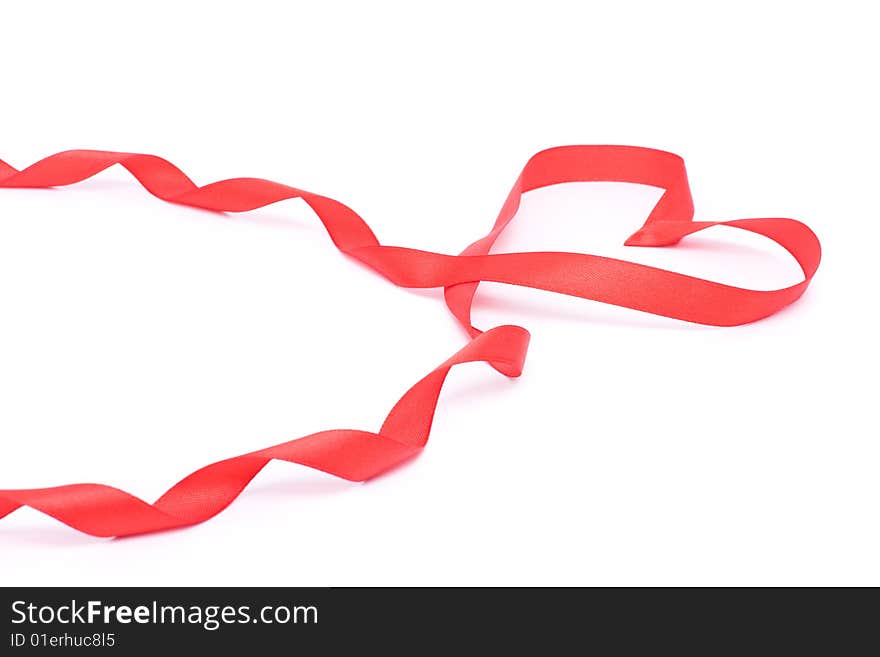 Red heart from ribbon for valentine isolated over white