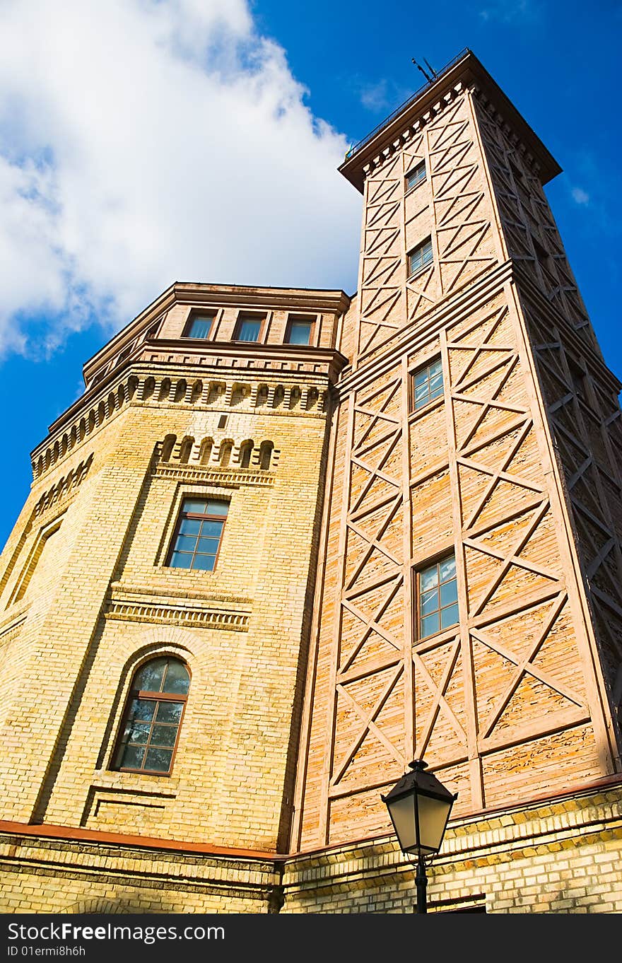 Brick building with a wooden tower