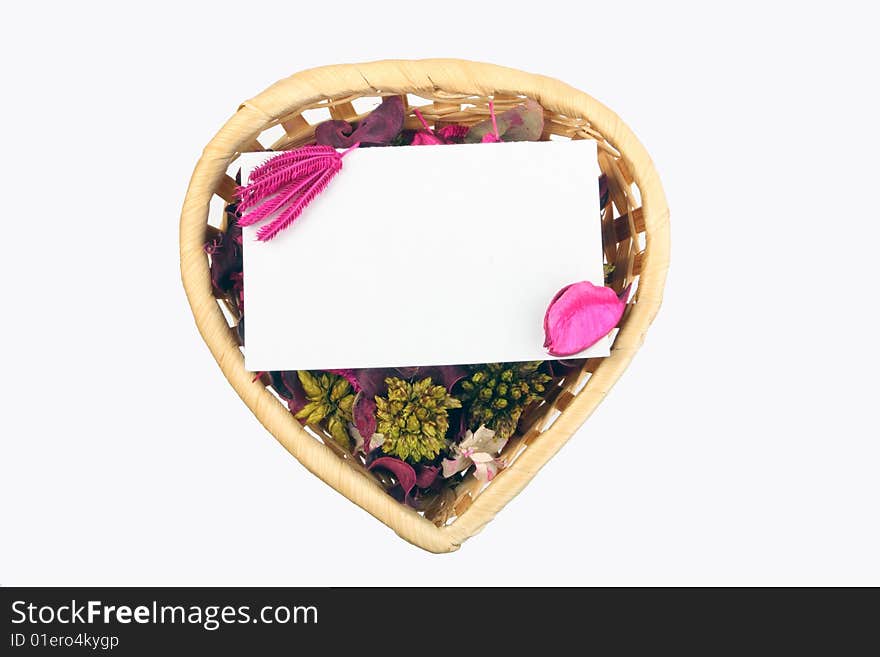 Heart-shaped basket with small clear sheet and flowers. Heart-shaped basket with small clear sheet and flowers