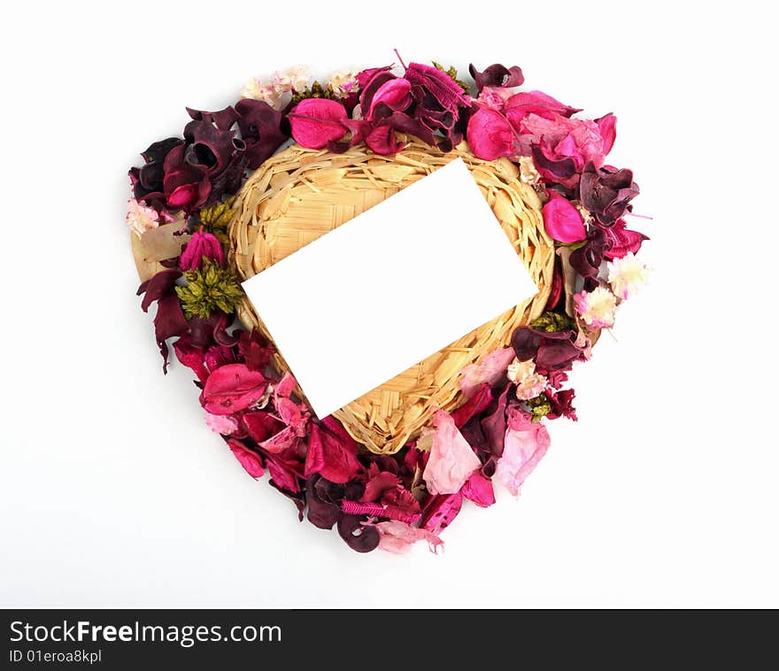 Heart-shaped basket with small clear sheet and flowers. Heart-shaped basket with small clear sheet and flowers