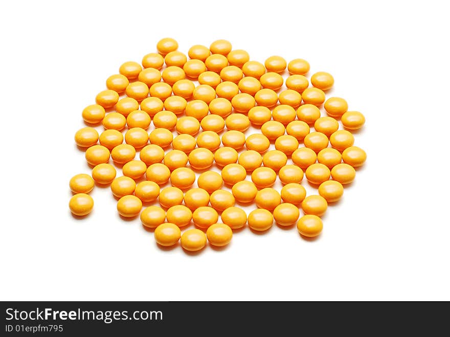 Yellow pills isolated on white