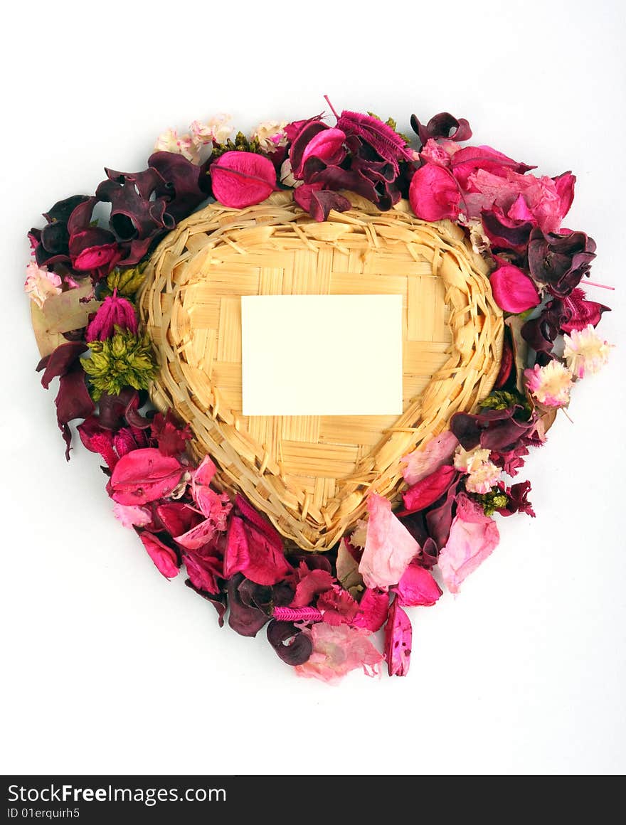 Heart-shaped basket with small clear sheet and flowers. Heart-shaped basket with small clear sheet and flowers