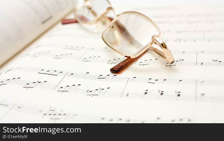 Close up image of glasses on book. Close up image of glasses on book