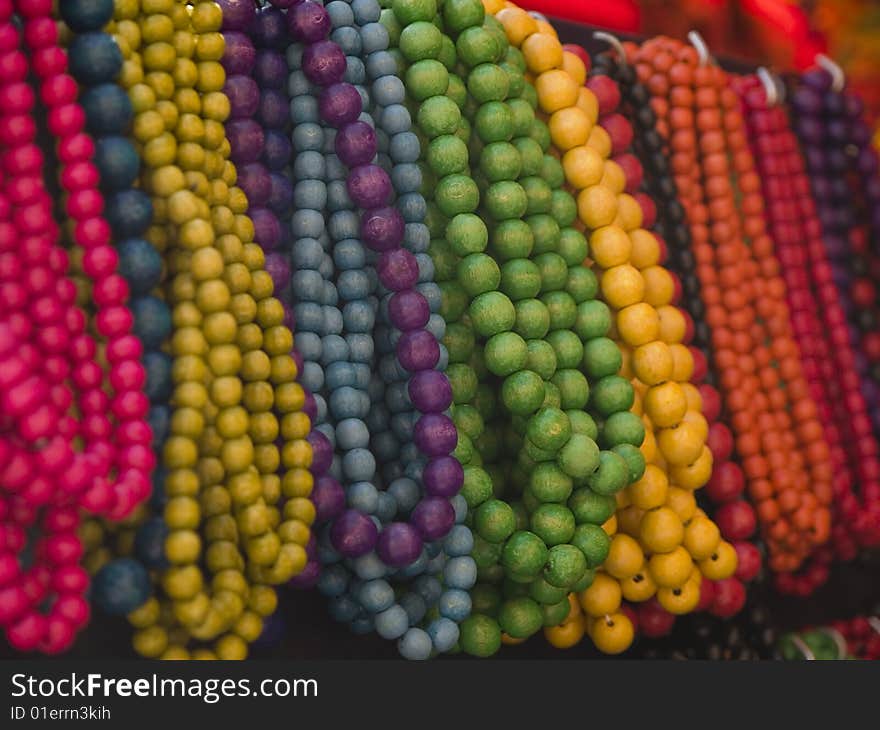 Wooden bead necklaces on a market stall. Wooden bead necklaces on a market stall