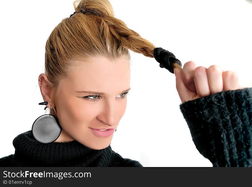 Young girl with hair in hand. Young girl with hair in hand