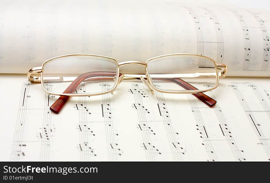 Close up image of glasses on book. Close up image of glasses on book