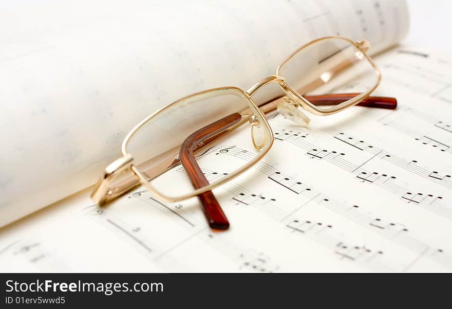 Close up image of glasses on book. Close up image of glasses on book