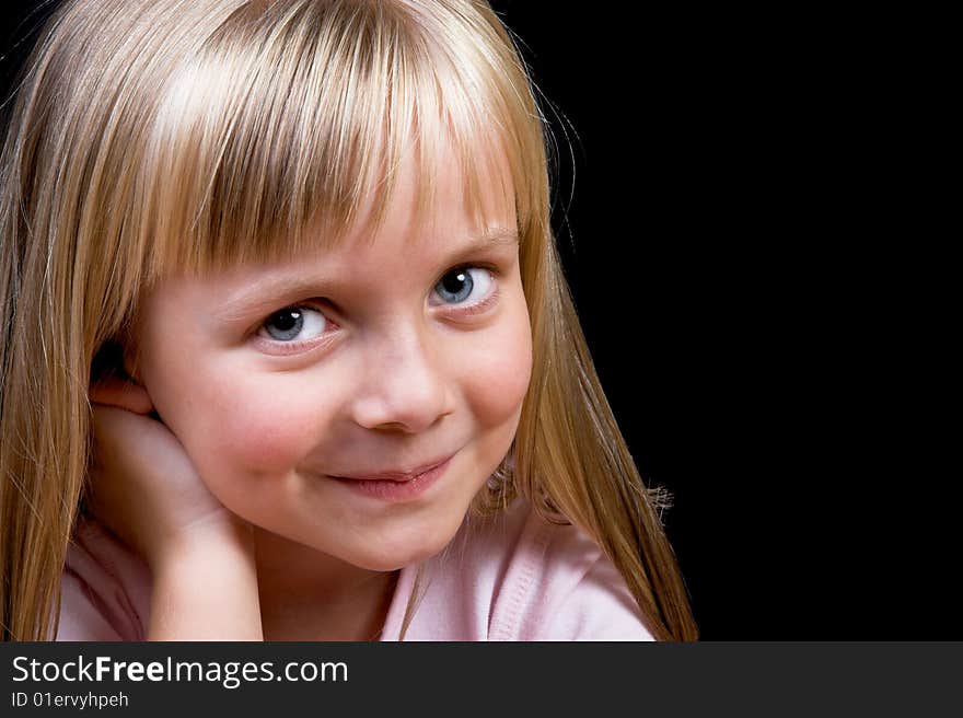 Blond Girl with big blue eyes on a black background