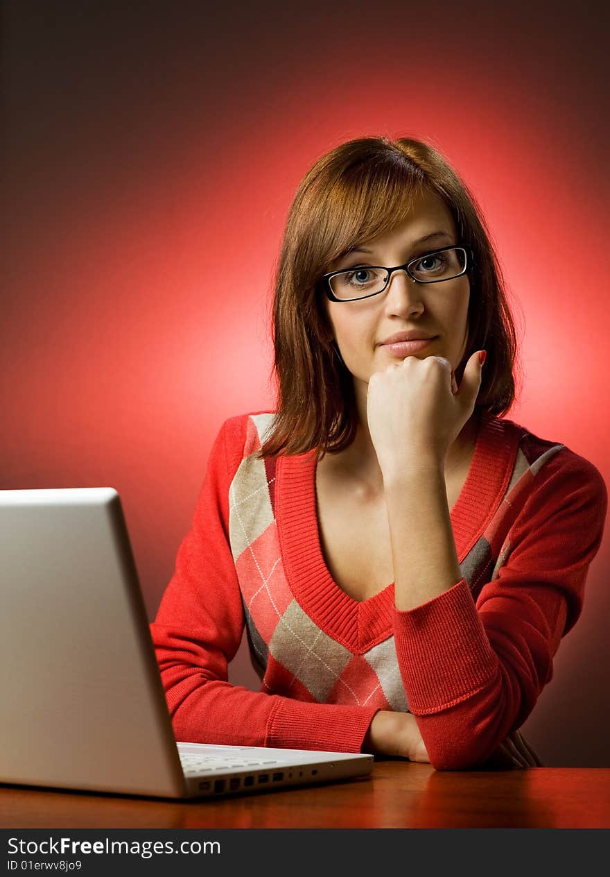 Beautiful young woman working on her laptop