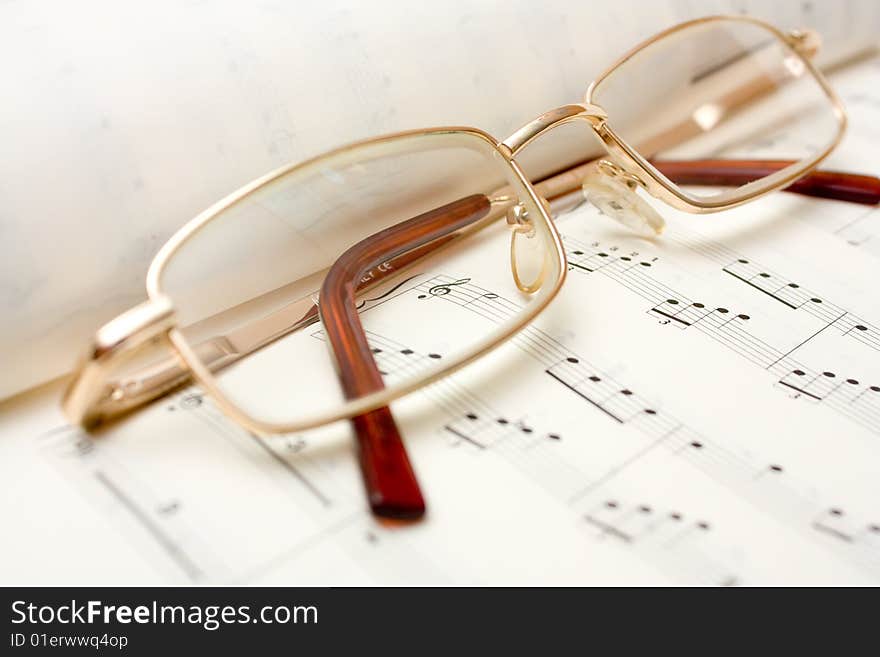 Close up image of glasses on book. Close up image of glasses on book