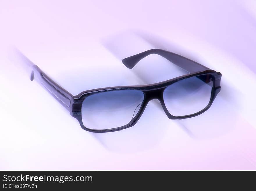 Sunglasses on the light background