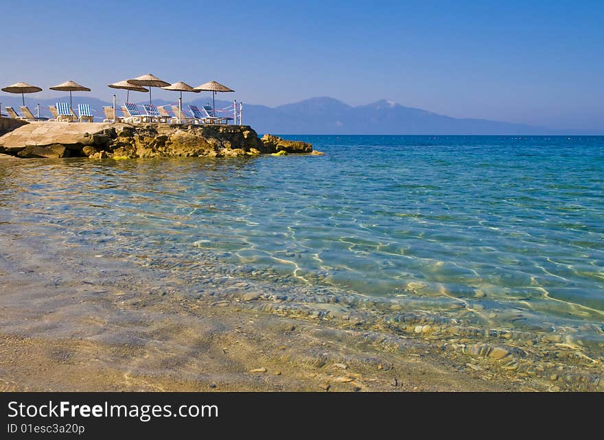 Sunshades in Turkish resort in the Aegean sea