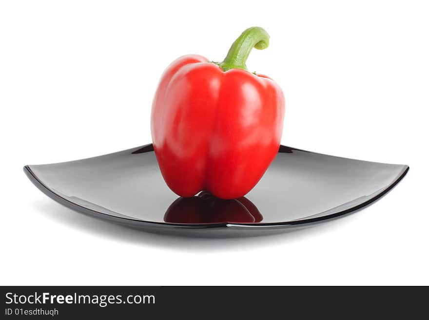 Red Pepper On A Black Plate