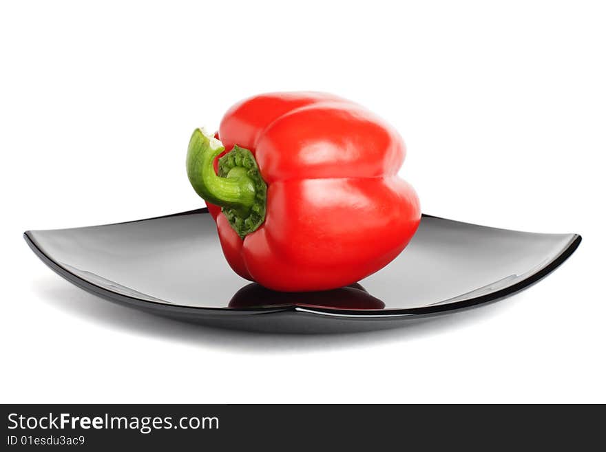 Red Pepper On A Black Plate