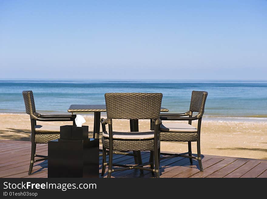 Romantic restaurant setting on a deck on the beach. Romantic restaurant setting on a deck on the beach.