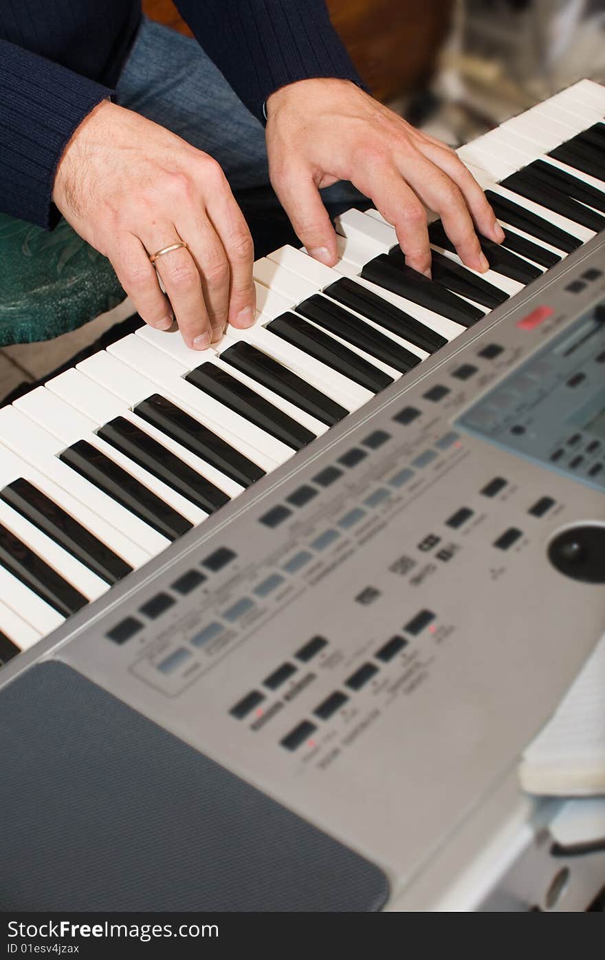 The musician plays a synthesizer. Electronic music.