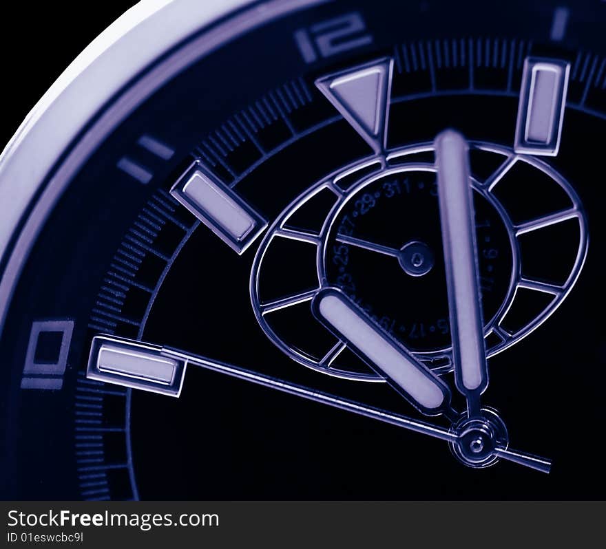 Time background showing hour minute and second hands of a watch taken at extreme closeup magnification