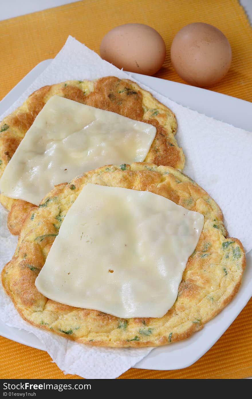 Baked Egg Omelette With Herbs And Cheese Slices On