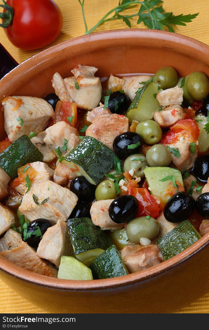 Turkey meat pieces with vegetable mix on plate