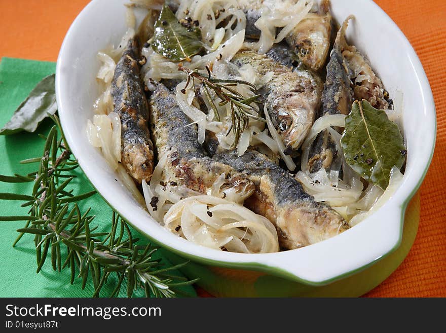 Anchovies with spice vegetable on plate