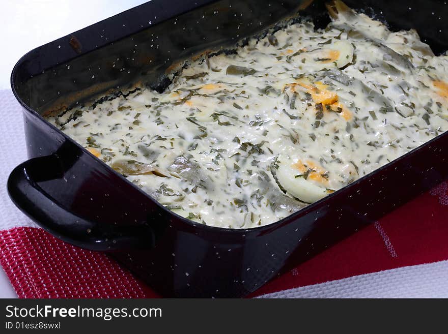 String beans and boiled eggs with cream poured over