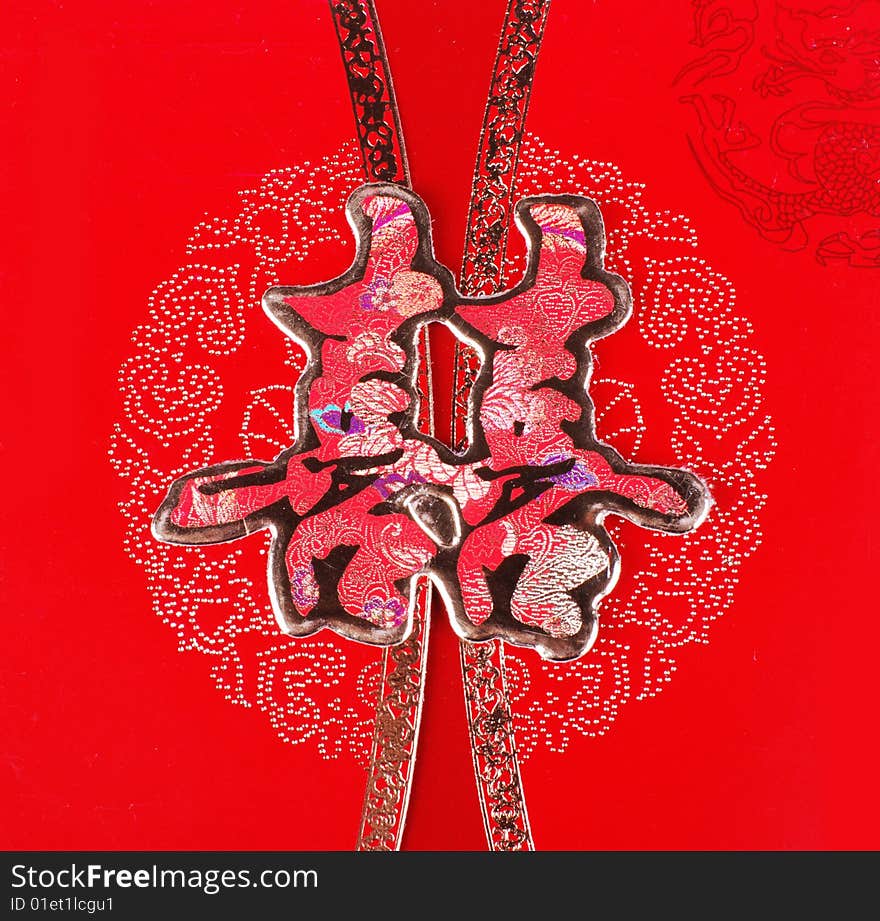 Chinese traditional symbol of marriage :double happiness. It means love and luck