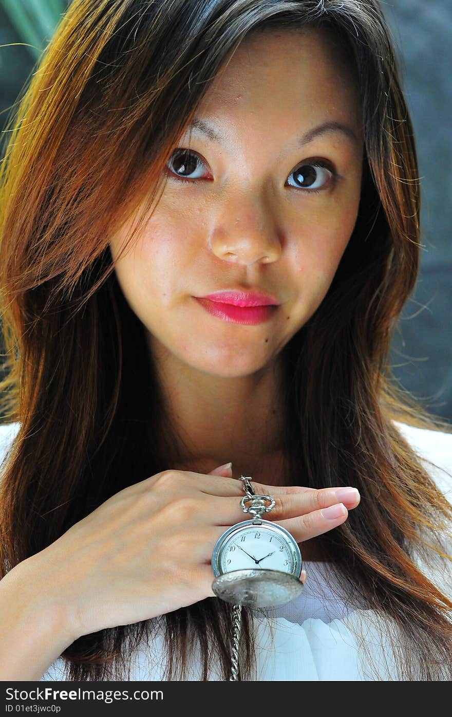 Modern Chinese Woman showing a watch telling time