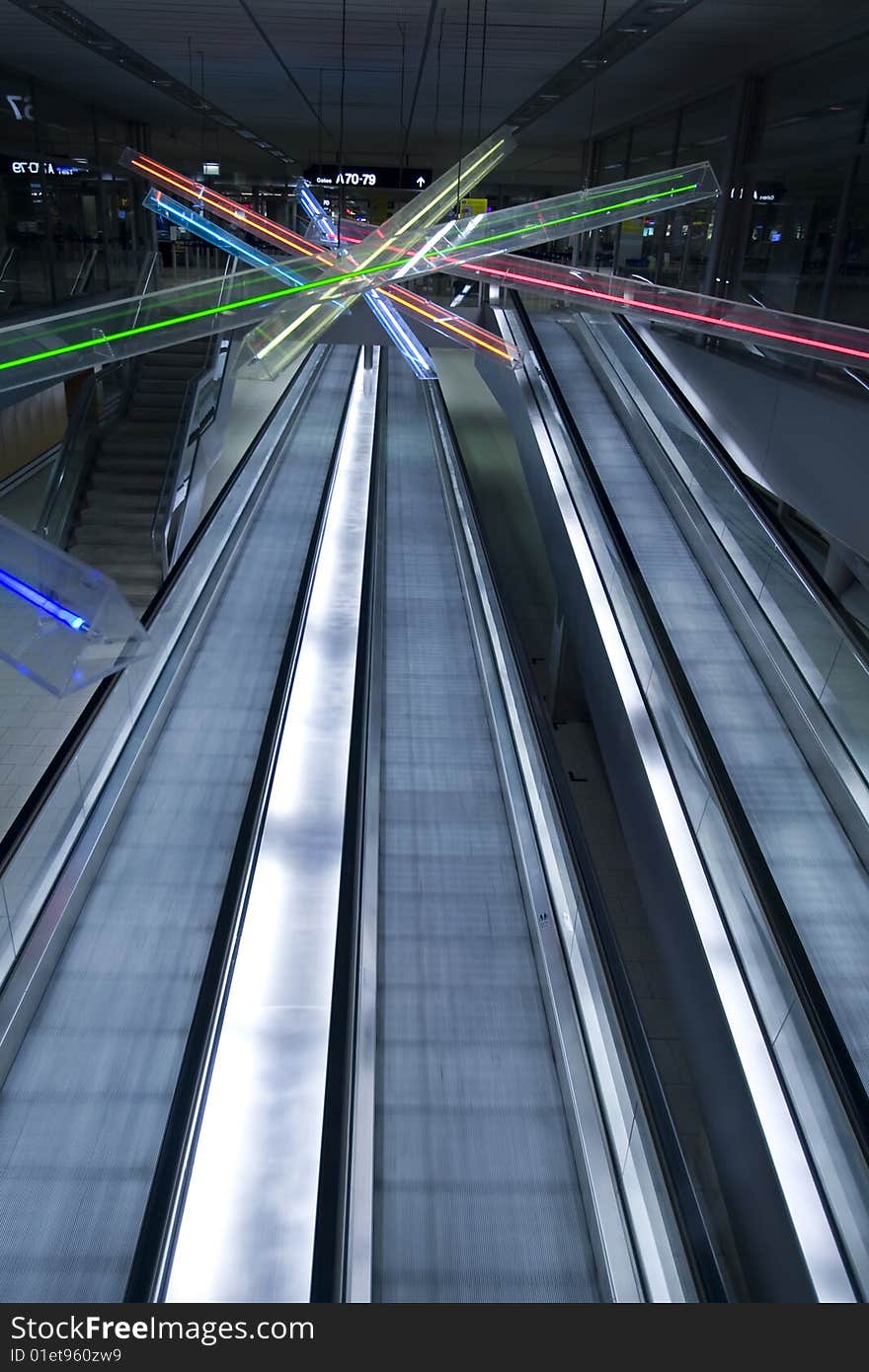 Three ways escalator in blue tone at Zurique Airport. Three ways escalator in blue tone at Zurique Airport