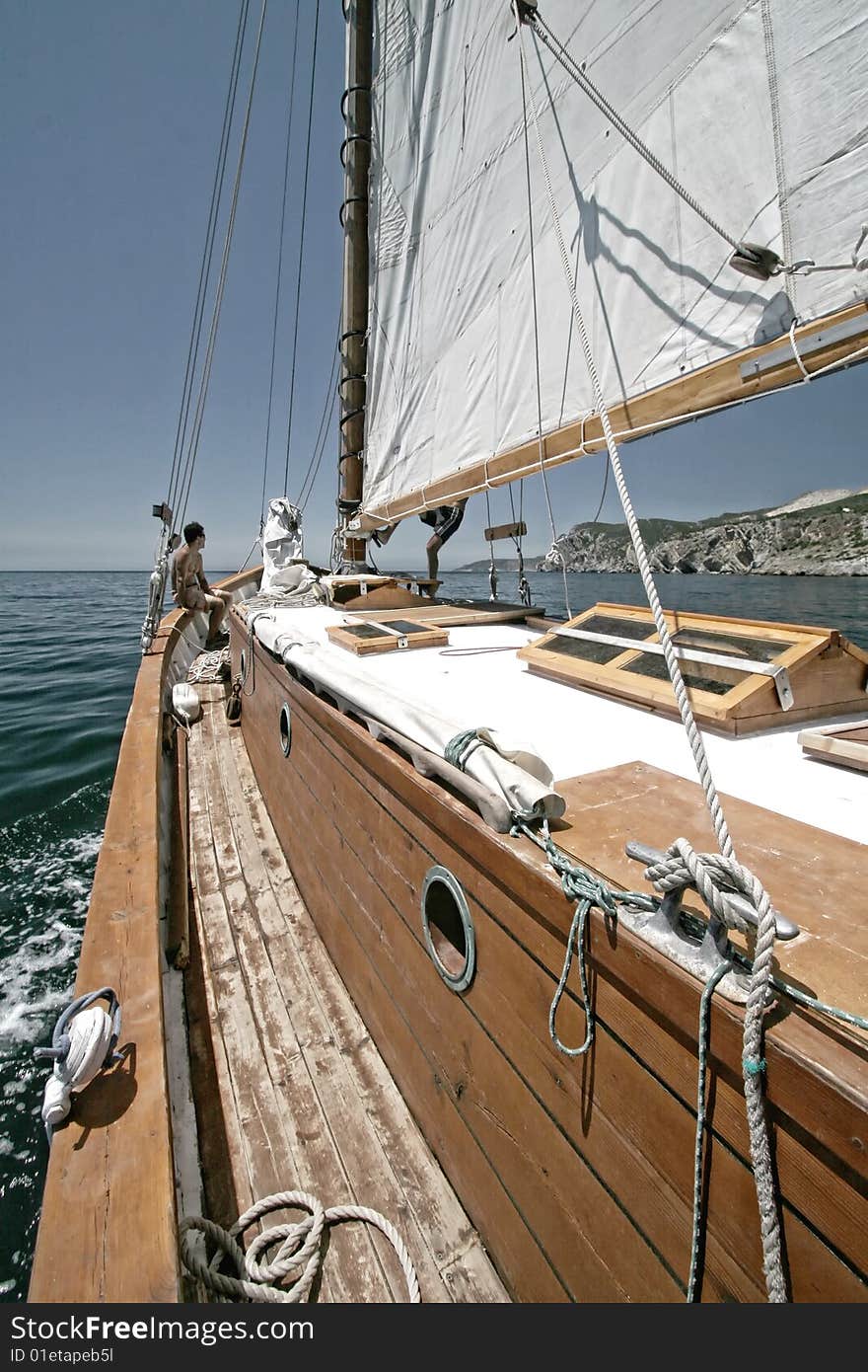 Sailboat sailing in a blue deep sea