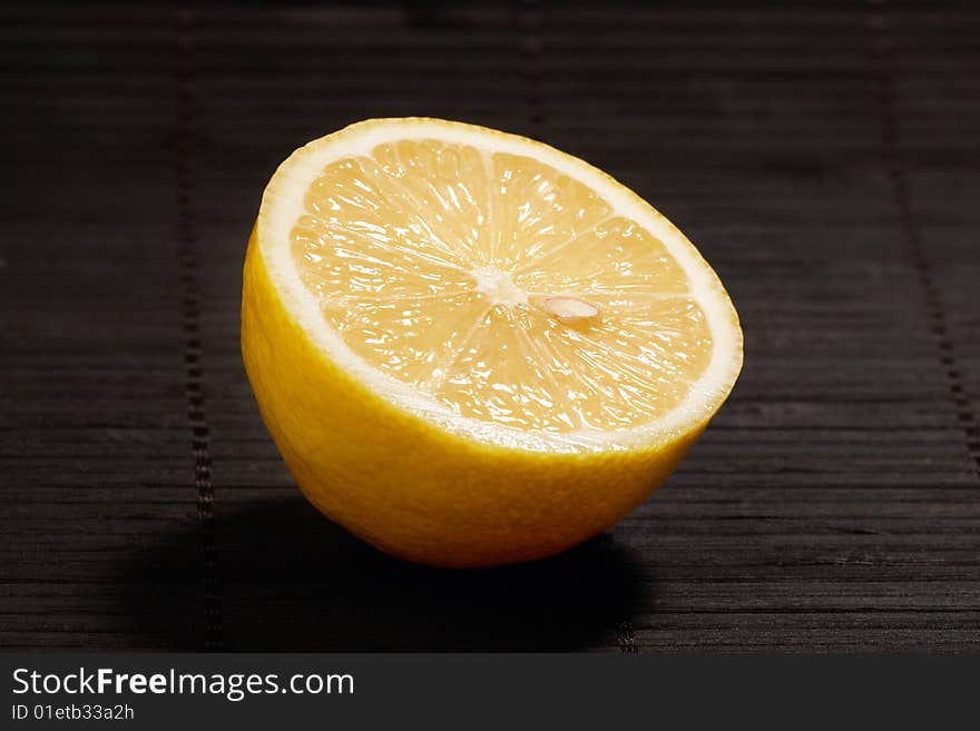 Lemon slice on dark background