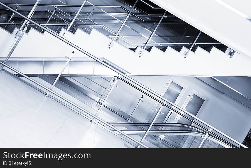 Escalator and stairs in the business center. Escalator and stairs in the business center