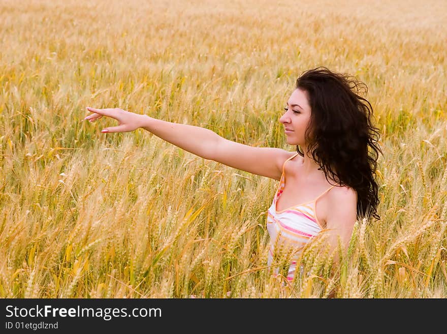 The happy woman on a yellow field