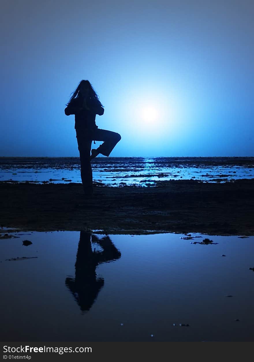 Alone girl streching on the coastline. Alone girl streching on the coastline