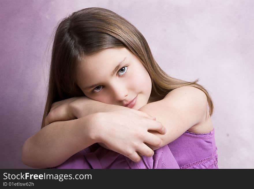 Beautiful young brunette against a pink background. Beautiful young brunette against a pink background