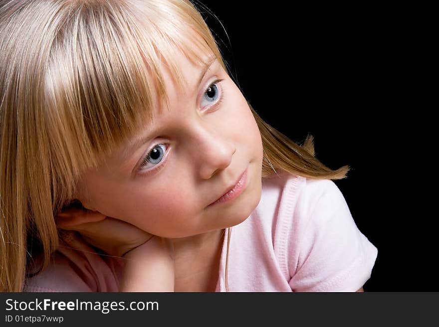 Blond Girl with big blue eyes on a black background