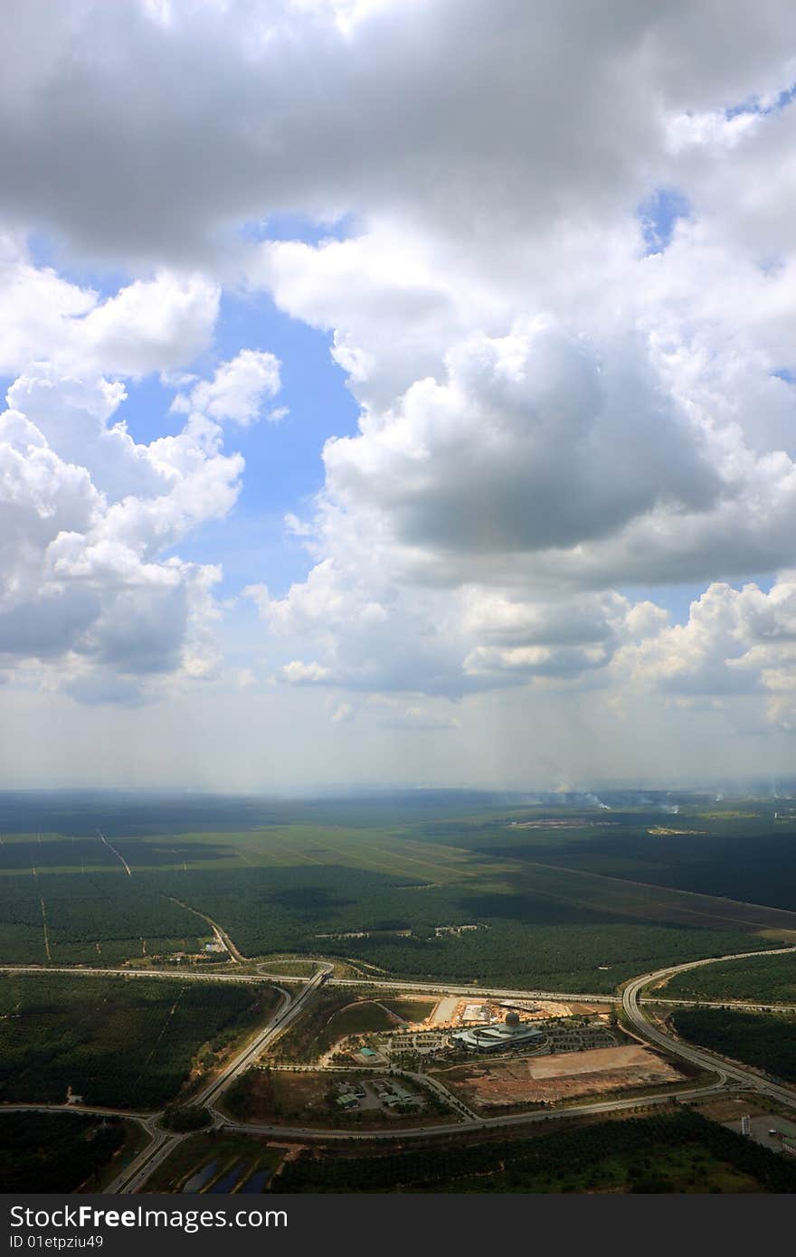 Aerial view of cloudscape over a cityscape.