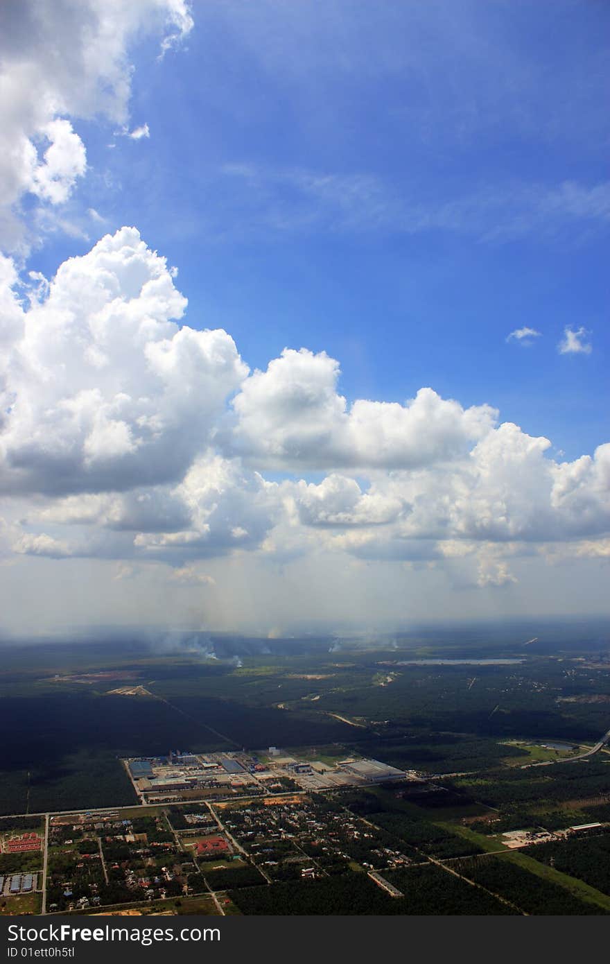 Aerial view of cloudscape over a cityscape.