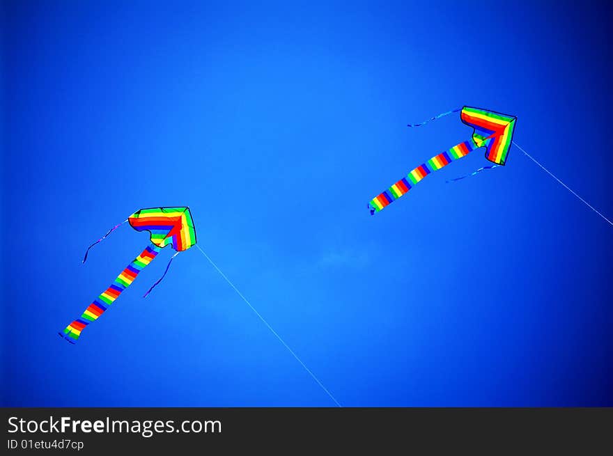 Two kites flew high in the sky. Two kites flew high in the sky