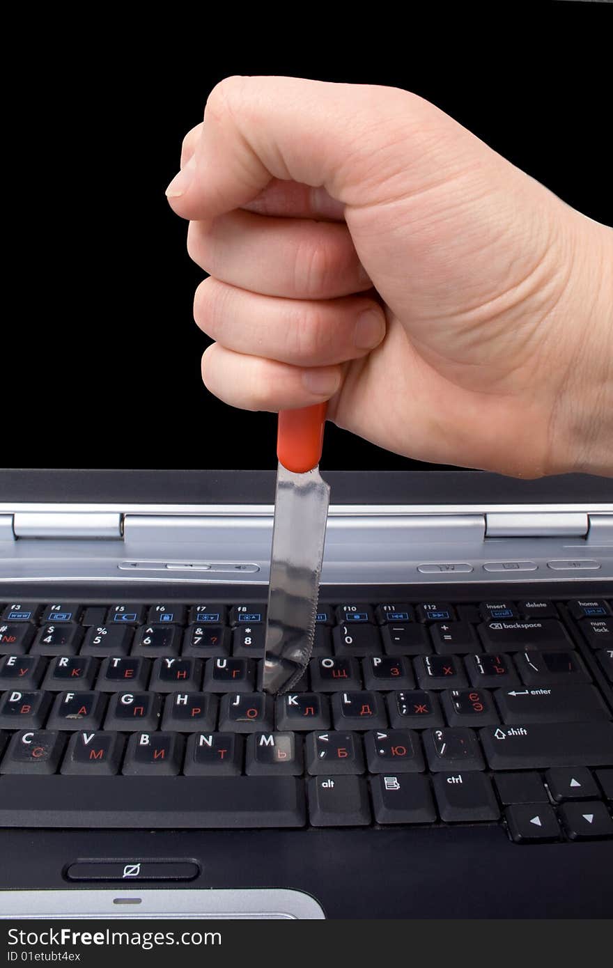 Hand With A Knife In The Laptop