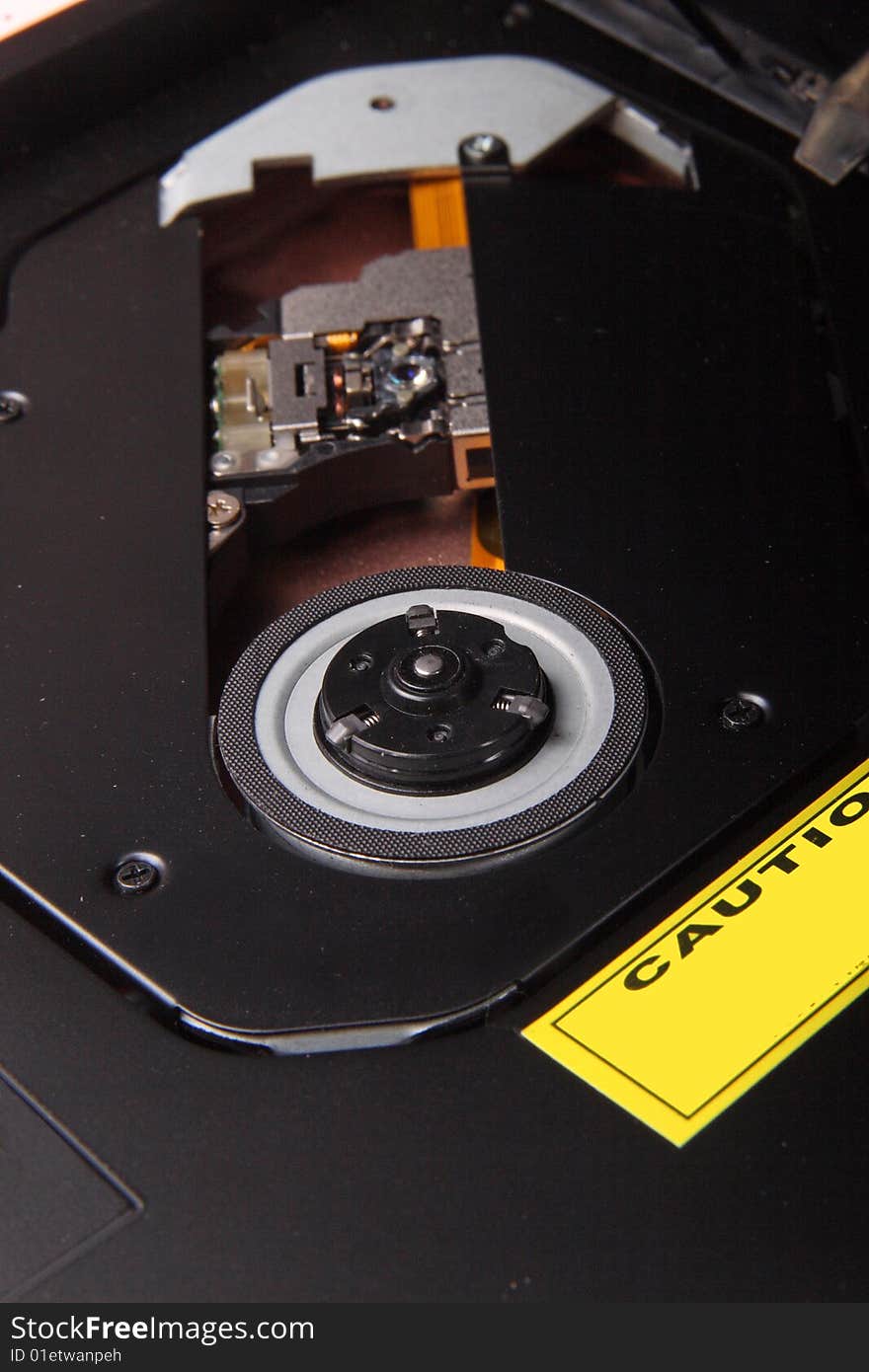 Close-up of a dvd optical drive and laser head . Close-up of a dvd optical drive and laser head .