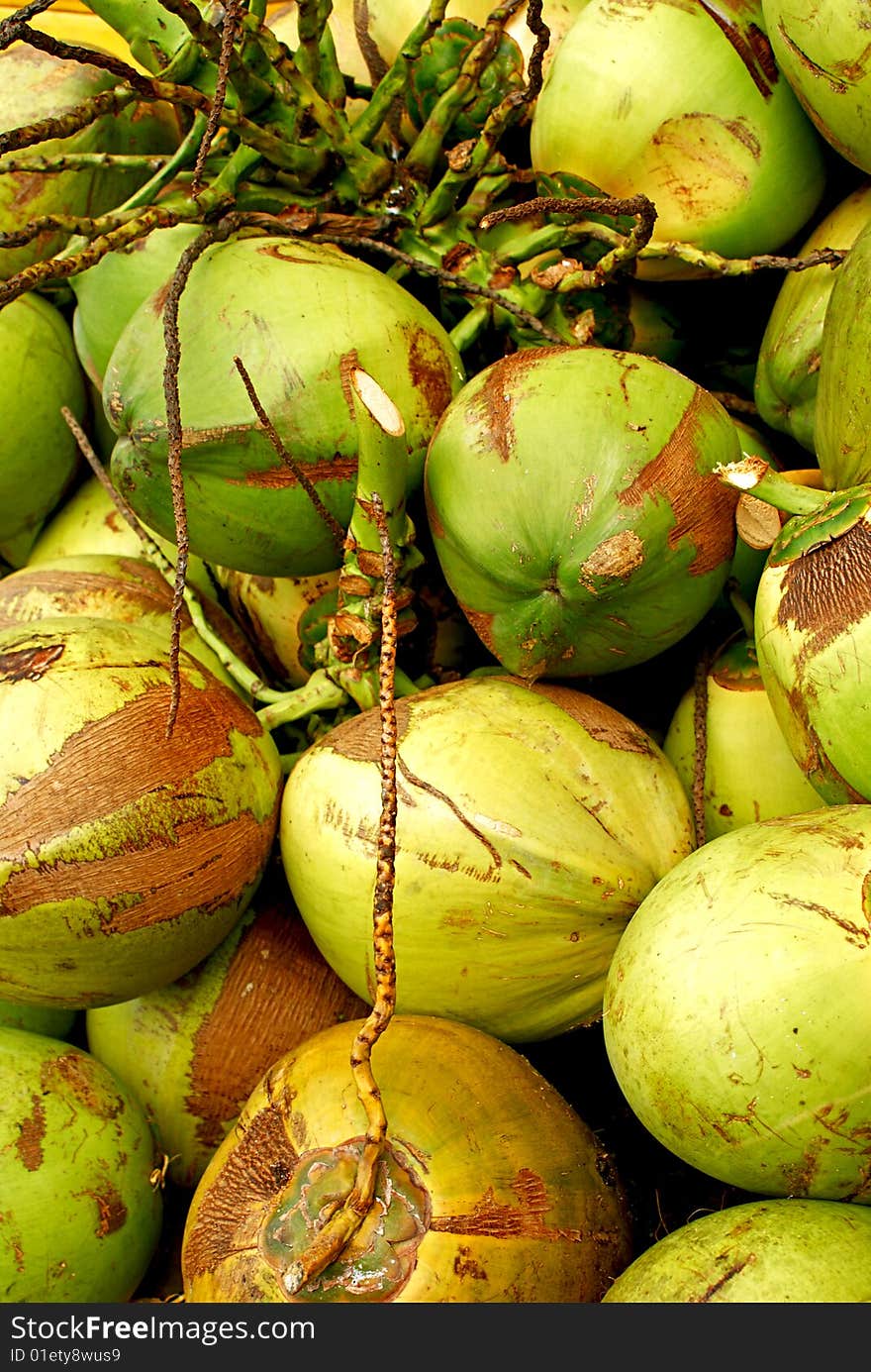 Piles of coconuts piled up together. Piles of coconuts piled up together.