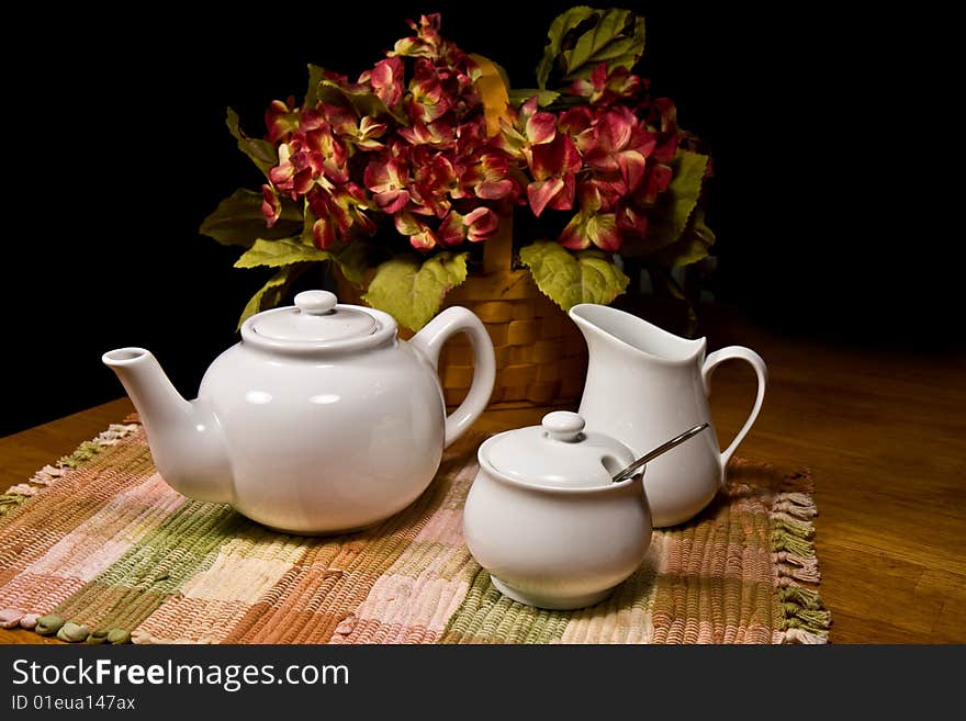 White porcelain Tea Set with floral arrangement. White porcelain Tea Set with floral arrangement