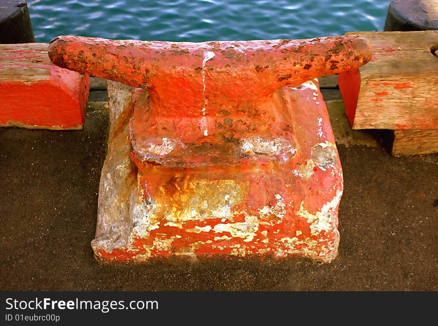 Old anchor on a deck at Half Moon Bay