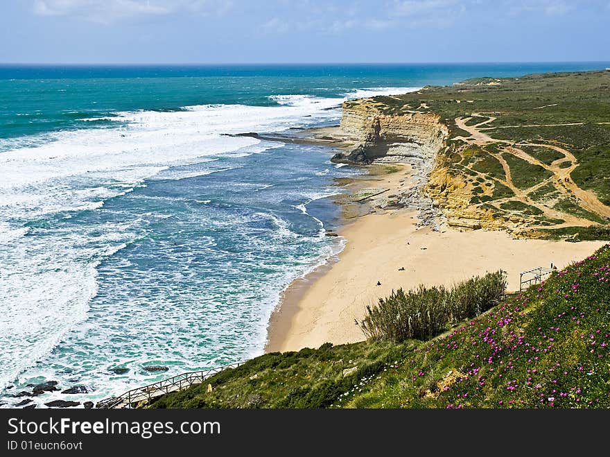 Deserted beach between rocks